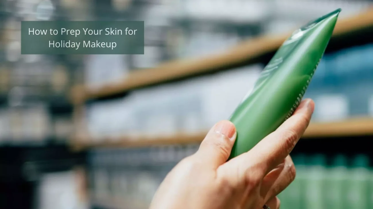 A hand holding a green skincare product in a store aisle.